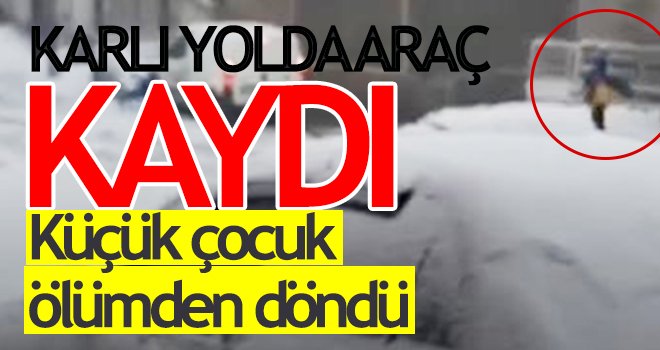 Küçük çocuk, karlı yolda kayan aracın altında kalmaktan son anda kurtuldu