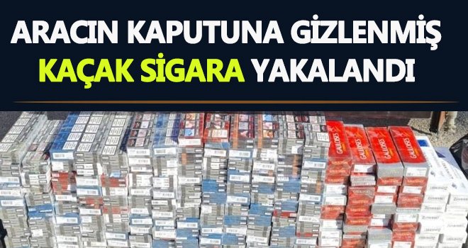 Aracın kaputuna gizlenmiş 2 bin 700 paket kaçak sigara yakalandı